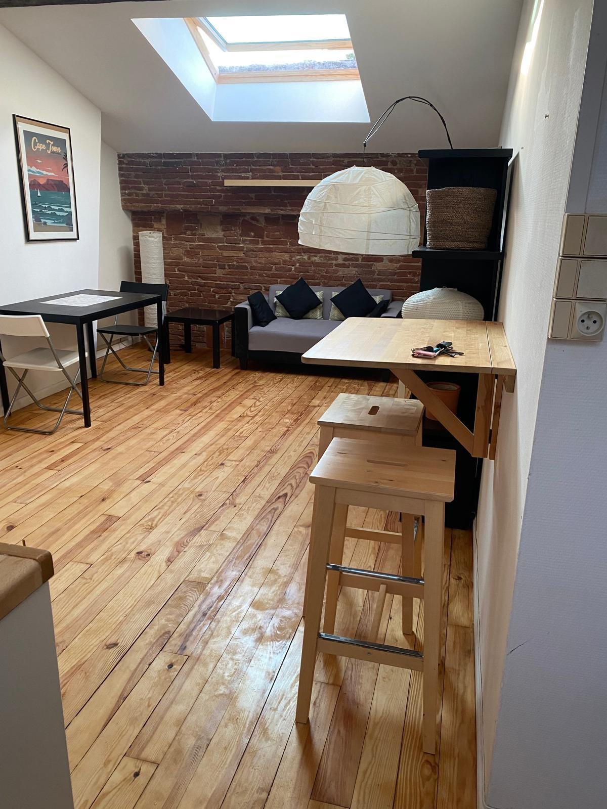 Interior renovation with yellow wall and painting supplies